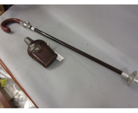 Vintage leather mounted shooting stick with leather covered glass and pewter top flask