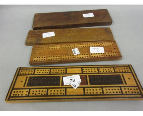 Four various wooden cribbage boards