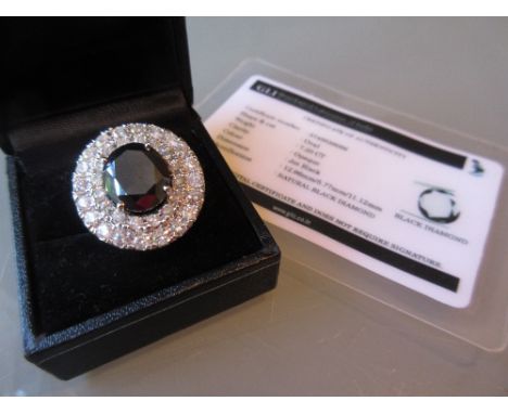 18ct White gold oval black diamond and brilliant diamonds ring, the black diamond approximately 7.20ct with certificate