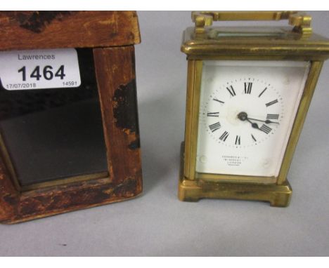 Brass cased carriage clock, the enamel dial inscribed Edwards and Sons (dial and glass at fault) in original leather carrying