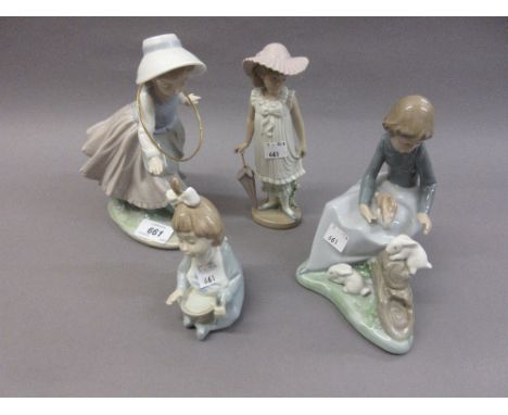 Four various Nao porcelain figures of children