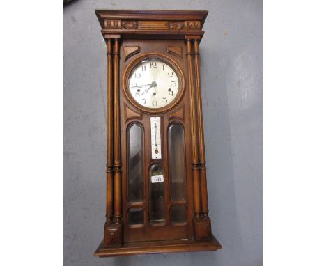 Continental walnut cased Vienna style wall clock having circular silvered dial with Arabic numerals and three train movement 