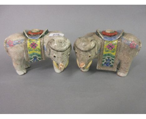 Pair of late 19th or early 20th Century Chinese Canton famille rose decorated elephant form candle holders (one at fault)   C