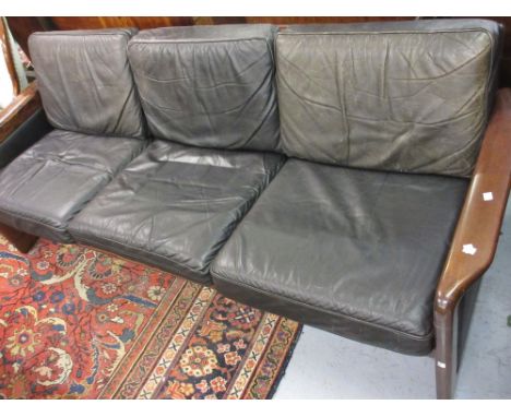 Mid 20th Century Danish hardwood black leather upholstered three seat sofa by Dyrlund of Denmark