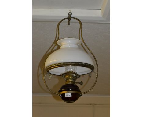 20th Century brass hanging oil lamp with glass well and opaque glass shade, pair of brass fire dogs with set of three brass f
