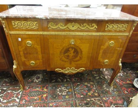 Continental Kingwood, burr wood and marquetry inlaid ormolu mounted commode, the flecked rouge marble moulded top above three