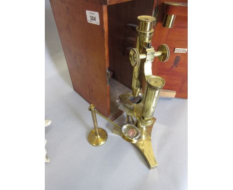 Late 19th or early 20th Century gilt brass monocular microscope by R. and J. Beck, London, No. 18333, with a bullseye lens in