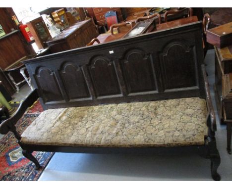 Antique oak open arm bench / settle having five panel back on cabriole pad front supports