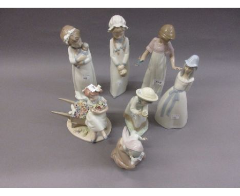 Four various Nao porcelain figures of children and three other Spanish porcelain figures