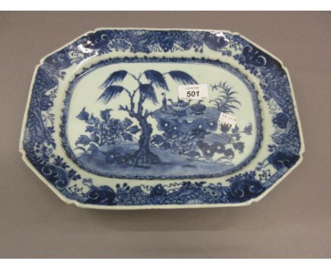 Small 18th Century Chinese blue and white irregular octagonal platter decorated with flowering shrubs, 12.25ins wide