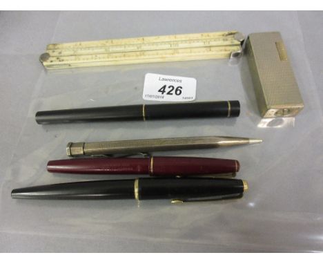 19th Century ivory folding rule together with a rolled silver propelling pencil, a cigarette lighter and four various fountai