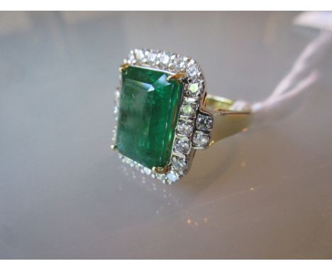 18ct Yellow gold large emerald and diamond cluster ring, the emerald approximately 6.92ct   CONDITION REPORT  Ring size M/N. 