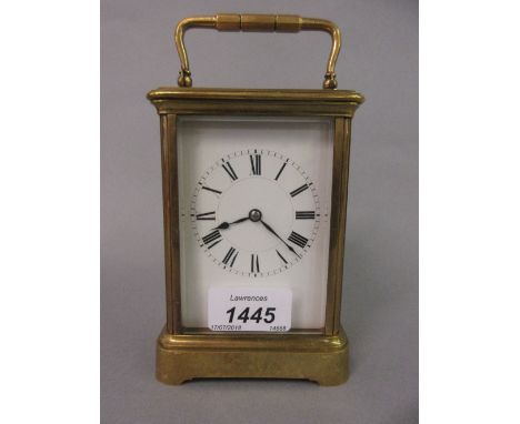 Late 19th or early 20th Century brass cased carriage clock, the enamel dial with Roman numerals and two train movement striki