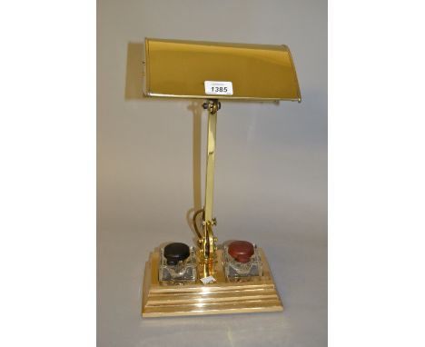 Art Deco patent desk lamp, the adjustable shade and arm above a rectangular plinth base with two glass inkwells, stamped Brit