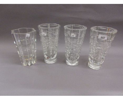 Set of three Orrefors facet cut glass flower vases, etched signature mark, 9.25ins high, together with a similar hexagonal va