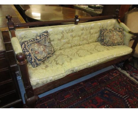 Mahogany hall bench with a rail back above yellow damask upholstered back and seat, raised on carved cabriole claw and ball s