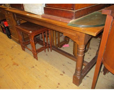 Reproduction rectangular oak refectory style dining table on turned supports with stretcher, together with a set of four repr