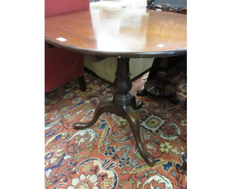 George III circular mahogany pedestal table with a turned column support and tripod base