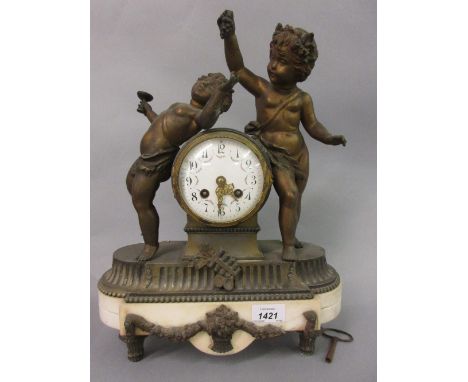 19th Century French gilded spelter and white marble mantel clock, the drum form case surmounted by two figures of Bacchanalia