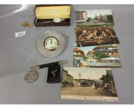 Bag containing a quantity of miscellaneous items including a circular mantel clock, 1951 crown, snuff box, postcards etc