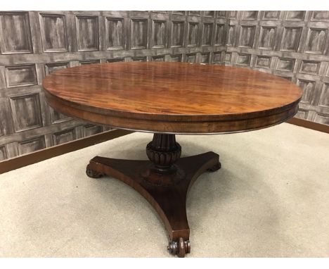 MAHOGANY BREAKFAST TABLE OF EARLY 19TH CENTURY DESIGNon a fluted outward tapering column terminating in a shaped tripod base,