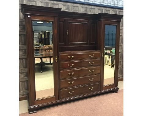 VICTORIAN MAHOGANY GENTLEMAN'S WARDROBEwith moulded inverse breakfront cornice, central panelled cupboard with interior hooks