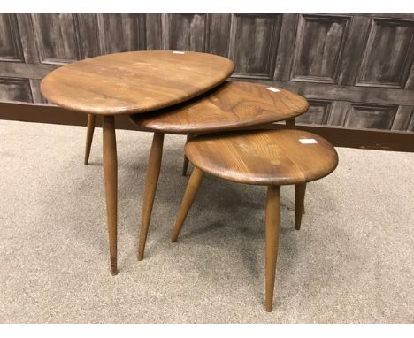 MID-20TH CENTURY ERCOL NEST OF THREE ELM TABLESof 'pebble' design, the smallest table bearing torn Ercol label to underside, 
