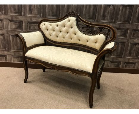 STAINED BEECH HALL SEAT OF ROCOCO DESIGNthe arched back with pierced scroll moulded panel, upholstered button back, arm rests