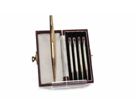 LIFE-LONG NINE CARAT GOLD PROPELLING PENCILin its original case, the pencil 13.5cm long; together with four silver bridge pro