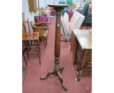 Mahogany Torchere, circa 1900, with circular dish top, carved and reeded support on tripod legs, 134cm high.