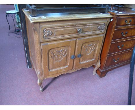 Light Oak Cabinet, with carving to drawer, over cupboard doors, 74.5cm wide.