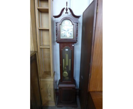 A 31-day mahogany triple weight longcase clock 