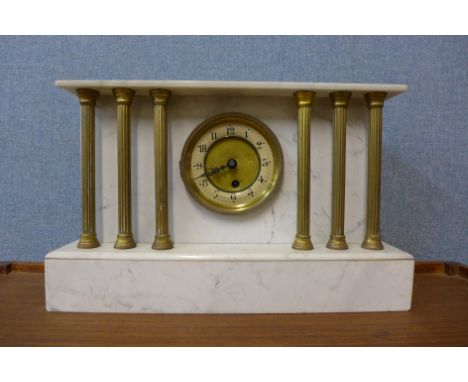 A 19th Century French marble and brass architectural cased mantel clock 
