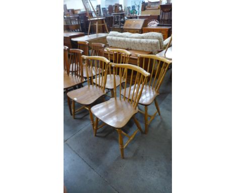 A set of four Ercol Blonde elm and beech chairs 