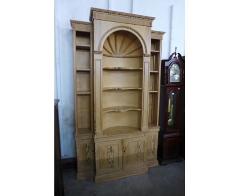 A George III style carved pine architectural library bookcase, 227cms h, 140cms w, 38cms d 
