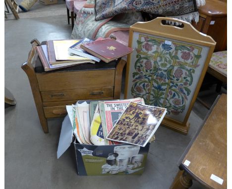 An oak piano stool, an oak firescreen and assorted sheet music 