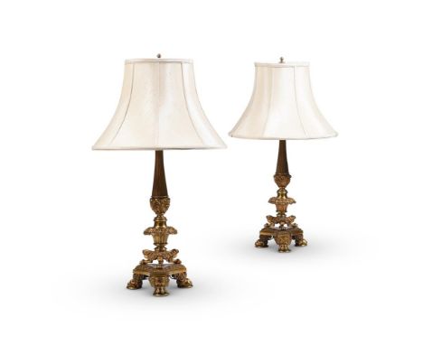 A PAIR OF ORMOLU TABLE LAMPS  19TH CENTURY  Each with shade on adjustable stem above floral knopped tapering column, Herculan