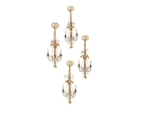 A SET OF FOUR GILTWOOD AND COMPOSITION TWIN BRANCH WALL LIGHTS  FIRST HALF 19TH CENTURY  Ribbon finials above swag drop backp