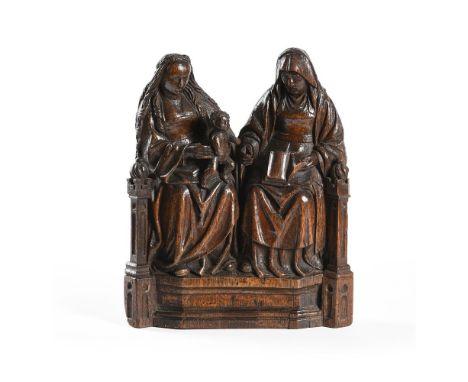 A CARVED OAK GROUP OF THE VIRGIN AND CHILD WITH SAINT ANNE 'ANNA SELBDRITT'  ANTWERP, EARLY 16TH CENTURY  With figures seated