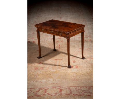 A FINE QUEEN ANNE FIGURED WALNUT SIDE TABLE CIRCA 1710 The quartered veneered and feather banded top with  caddy moulded edge