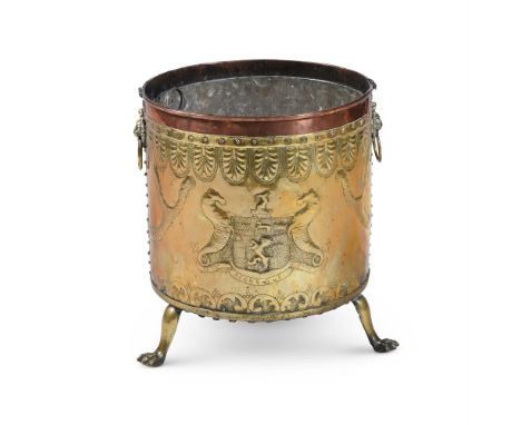 A LARGE DUTCH BRASS AND COPPER LOG BIN  LATE 19TH CENTURY  With armorial of seahorses flanking shield with rampant lion, mott