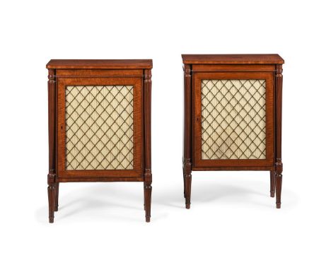 A PAIR OF REGENCY MAHOGANY SIDE CABINETS CIRCA 1820 The grille and pleated silk doors opening to an adjustable shelved interi