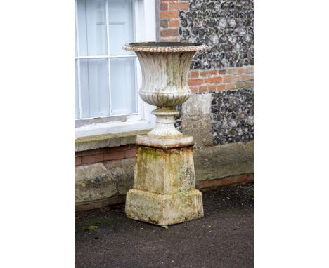 A LARGE CAST IRON CAMPANA URN ON BASE  19TH CENTURY  131cm high overall, base 42cm square   Condition Report:  Wear, marks, k