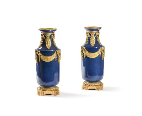 A LARGE PAIR OF ORMOLU MOUNTED BLUE PORCELAIN VASES  FRENCH, 19TH CENTURY  each approximately 49cm high overall, bases 16.5cm