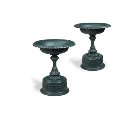 A LARGE PAIR OF VICTORIAN CAST IRON PEDESTAL URNS  IN THE MANNER OF HANDYSIDE, CIRCA 1870-1890  With flared basins with mould