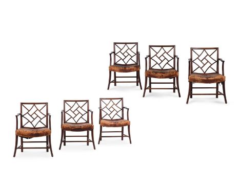 A SET OF SIX MAHOGANY COCKPEN ARMCHAIRS IN GEORGE III STYLE, 20TH CENTURY The saddle seats with leather upholstery, the feet 