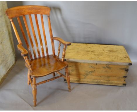 A Late 19th Century Pine Trunk, with end handles, together with an elm kitchen armchair