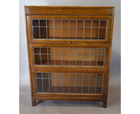 A Globe Wernicke Style Oak Three Section Bookcase with lead glazed doors