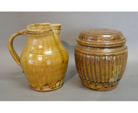 A Studio Pottery Jug by Mike Dodd, 18 cms tall, together with a similar Studio Pottery tea caddy by Mike Dodd, 16 cms tall