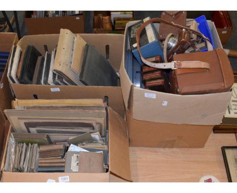Two boxes of Victorian and later portrait and other photographs in albums, together with a box of photographic equipment incl